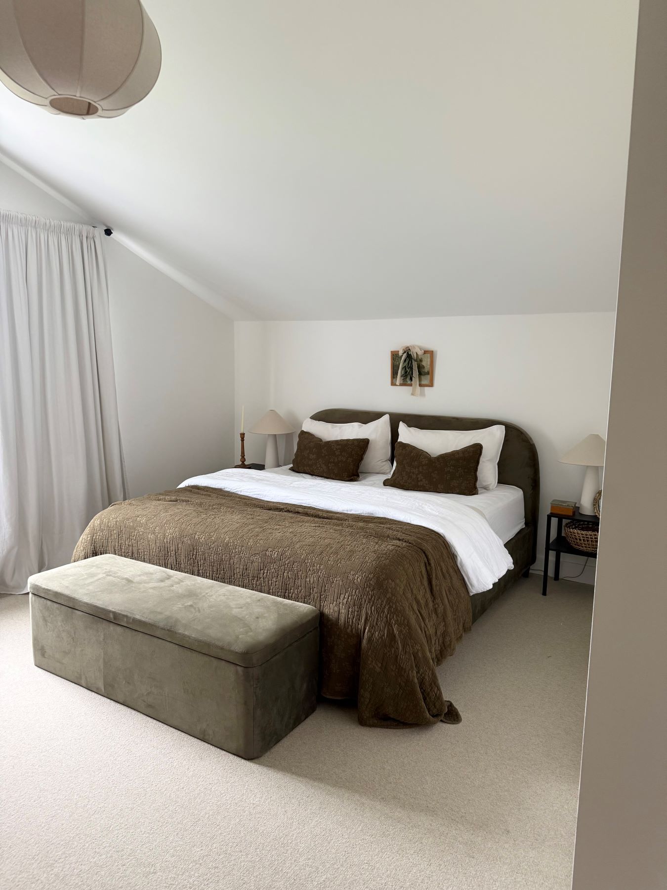 cream bedroom carpet with a khaki green velvet double bed
